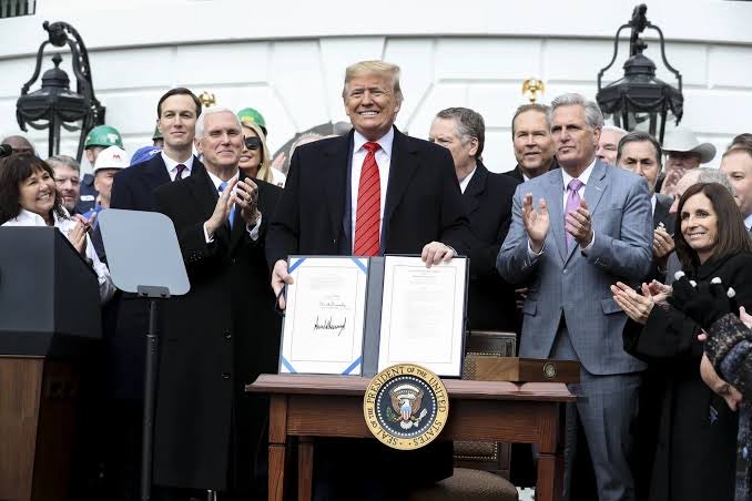 shanaka86's tweet photo. The largest trading relationship in the Western Hemisphere, 1.6 trillion dollars in goods a year, just lost its guarantee of permanence, and the lever was built by the same man who just pulled it. 

On 1st July, the United States refused to renew the USMCA, the North American trade pact which President Donald Trump signed in his first term and once called the fairest deal America ever made.

I suggest that you read the fine print, because nearly every headline has it wrong. 

Nothing expired. No tariff moved on July 1st. 

The pact stays fully in force until 2036. 

What Washington declined was the optional 16-year extension, the button that would have locked the deal in for another generation. Refuse to press it, and the agreement flips into a new mode: an annual review, every year, for a decade, until the three countries either renew it or let it die in 2036.

One interesting detail makes this surgical rather than reckless. That annual-review clause was not imposed on Trump. He wrote it. 

When Trump’s team replaced NAFTA in 2020, they baked in a joint-review mechanism with almost no precedent in trade history, a self-renewing pressure valve built into the treaty itself. 

On July 1st he simply switched it on. The uncertainty is not a failure of the deal. It is the weapon designed into it.

That is why this cuts deeper than a tariff. A tariff is a number you can price. This is the removal of the horizon. Think! 

A company weighing a plant meant to run 30 years now has to plan against a trade regime guaranteed for one. Auto lines whose parts cross these borders several times before a Car exists sit in the center of it. Capital can absorb a cost. It cannot absorb not knowing.

The irony runs deeper still too. President Trump's own tariffs drove companies to pull their supply chains out of China and into Mexico, and that migration did exactly what it was built to do, lifting the US goods deficit with Mexico to 196.9 billion dollars, the very figure the administration now waves as proof the deal is broken. 

The policy manufactured its own grievance.

Then set his words against the facts. Trump said in June 2026, we do not need anything Canada has, we do not need anything Mexico has, but they need everything we have. 

Trumps 51st state Canada is the single largest source of the crude oil the United States runs on, and both neighbors hold critical minerals America cannot yet supply for itself. The country that says it needs nothing imports the fuel in its own gas tank from the neighbor it claims to carry.

So this is where the continent stands. For 30 years, since NAFTA in 1994, North America traded as one market its members could build a future on. As of July 1st that future comes up for a vote every twelve months, on a clause its own architect installed for exactly this moment. 

The rules have not changed. What changed is that nobody can promise they will hold a year from now, and a continent of factories, farms and supply chains has to live inside that sentence.