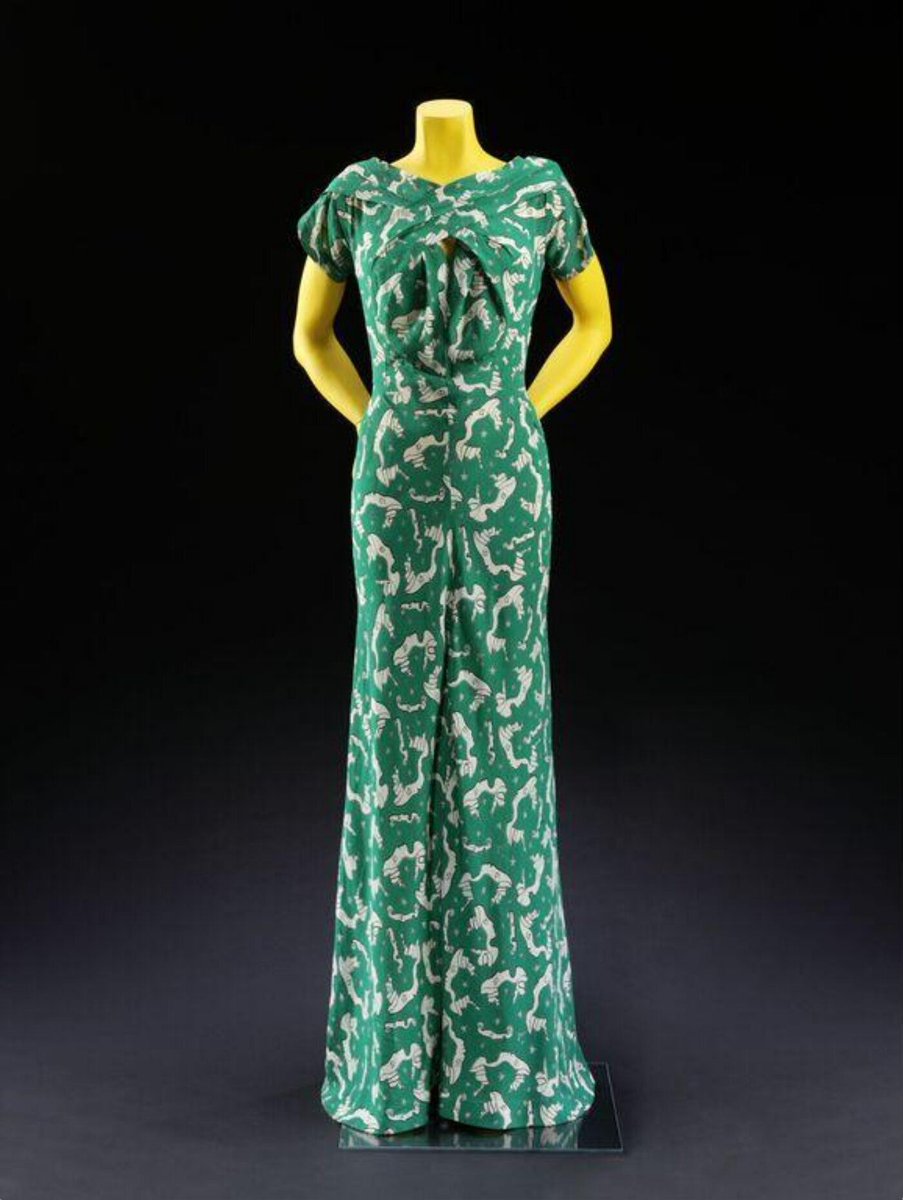 vickyhaddock's tweet photo. French poet, novelist, designer, filmmaker, visual artist and critic Jean Cocteau was born #OnThisDay in 1889. This 1938 green silk Charles James evening dress is printed with a Cocteau art print of masks of Cocteau and his lover, the actor Jean Marais. @V_and_A #fashionhistory https://t.co/EwnrQ15Ly0