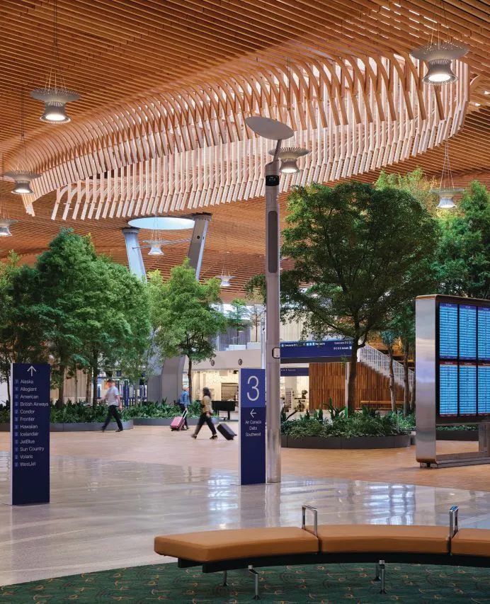 quorumcaller's tweet photo. here's Portland's new terminal and Xi'an's railway station side by side. the wood and light is welcoming. the futurist design feels hostile https://t.co/2alfNeIq0r