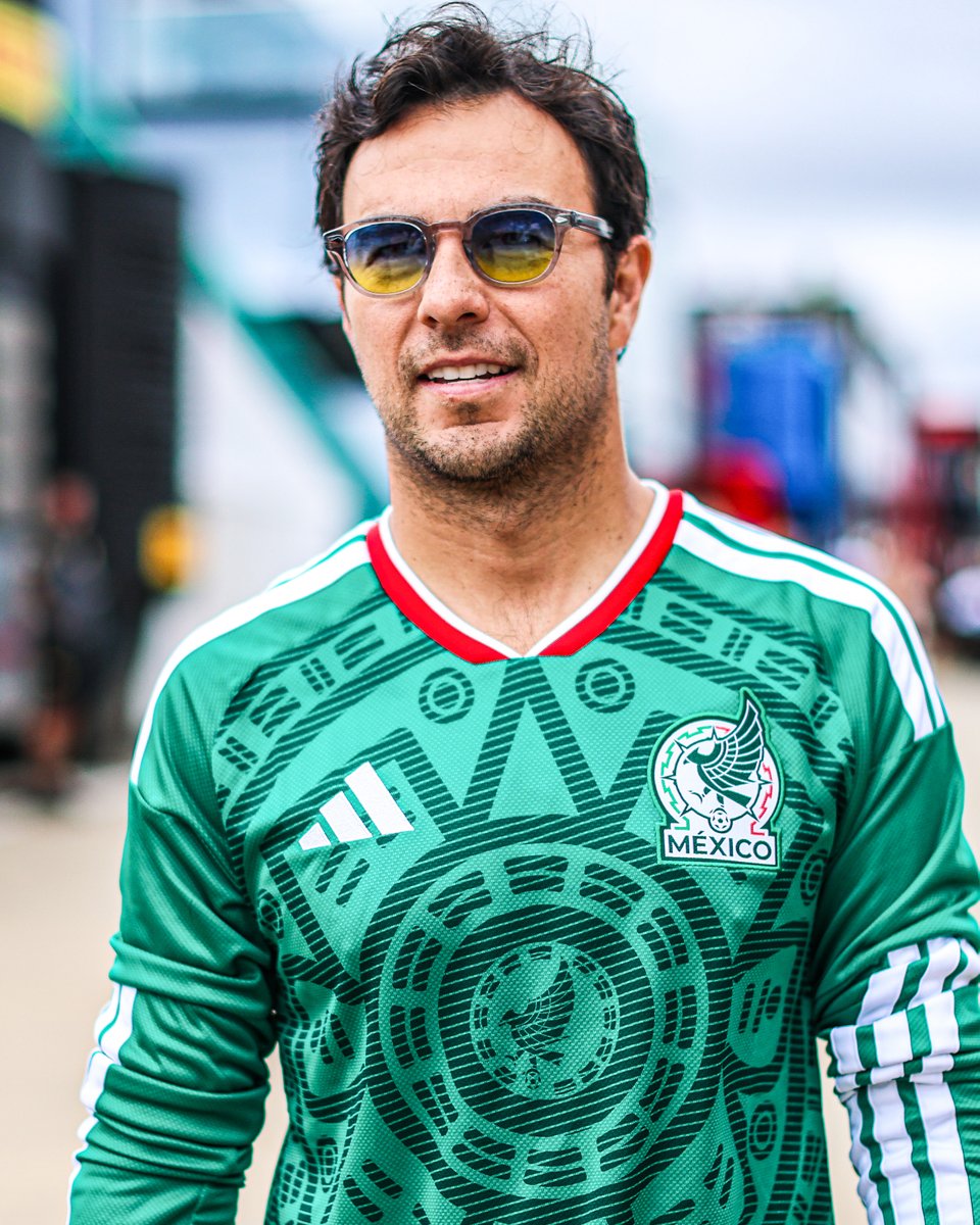 autosport's tweet photo. Sergio Perez repping the Mexico kit at Silverstone today ahead of their match against England. Bold move 👕🇲🇽 https://t.co/a7bXb2rrdA