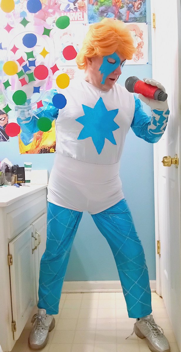 LenhardtEric's tweet photo. Okay here's my newest cosplay of my girl Dazzler for everyone! I will probably put some white lines on the starburst on the T-shirt but for pictures it's okay #cosplay #dazzler #xmen #hellfiregala #thriftstorefinds #morphsuit #wigs #silverglittershoes #microphone #cosplaypowers https://t.co/7rNVsA2uNa