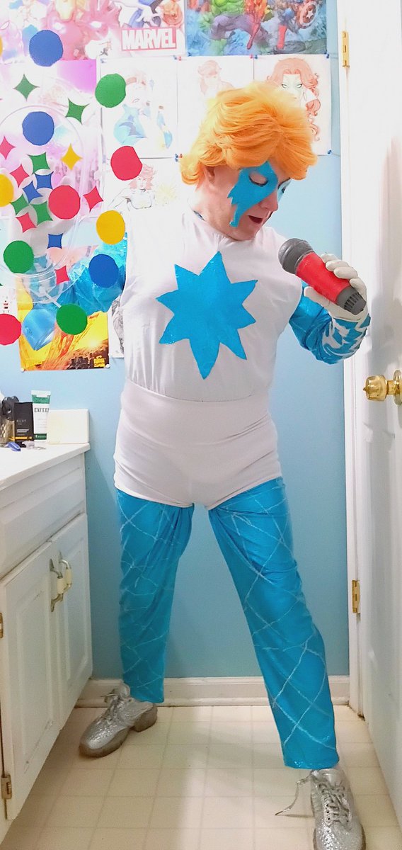 LenhardtEric's tweet photo. Okay here's my newest cosplay of my girl Dazzler for everyone! I will probably put some white lines on the starburst on the T-shirt but for pictures it's okay #cosplay #dazzler #xmen #hellfiregala #thriftstorefinds #morphsuit #wigs #silverglittershoes #microphone #cosplaypowers https://t.co/7rNVsA2uNa