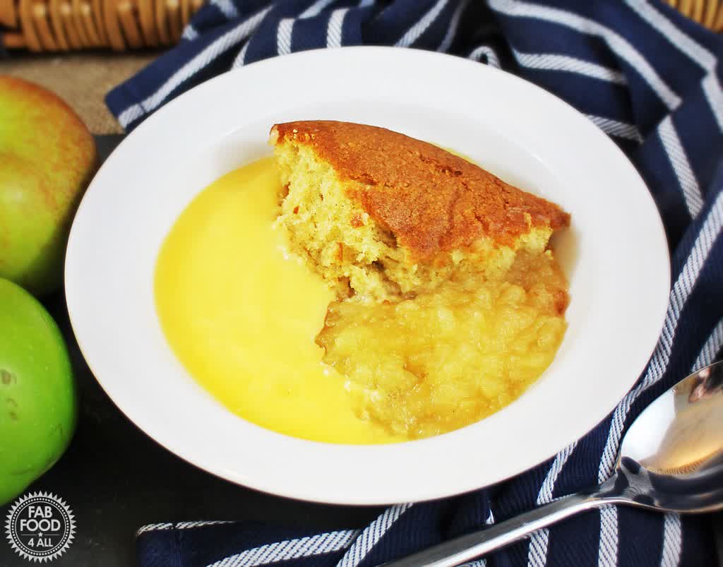 FabFood4All's tweet photo. In need of comfort food? Look no further than this British classic, Eve's Pudding. A layer of vanilla sponge sits on top of stewed apples, which, when served with custard, is the ultimate pudding! https://t.co/0YkxJEGflM #evespudding #pudding #applesponge #autumnrecipe https://t.co/oTd8wJ676C