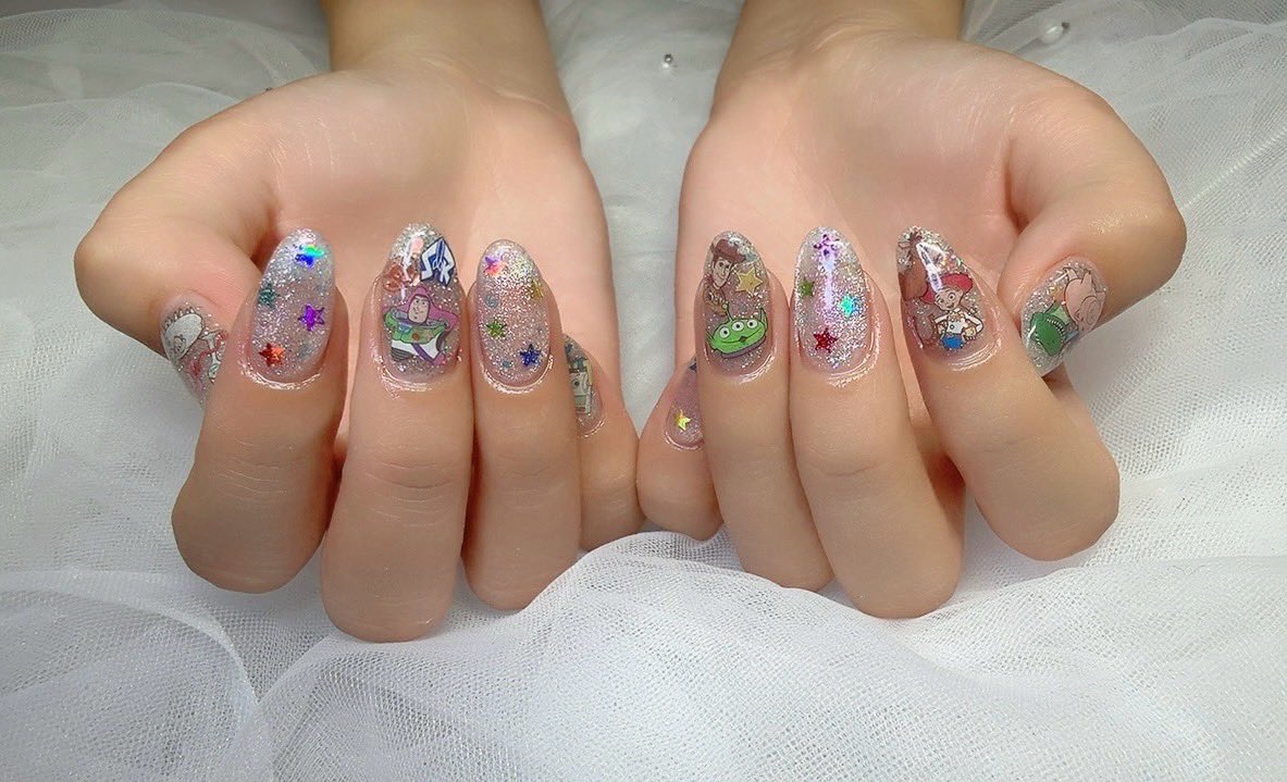 5l_uu's tweet photo. ディズニー行くし映画もあるからトイストーリーネイルにしてもらったー💅★* https://t.co/0csKvIgNQy