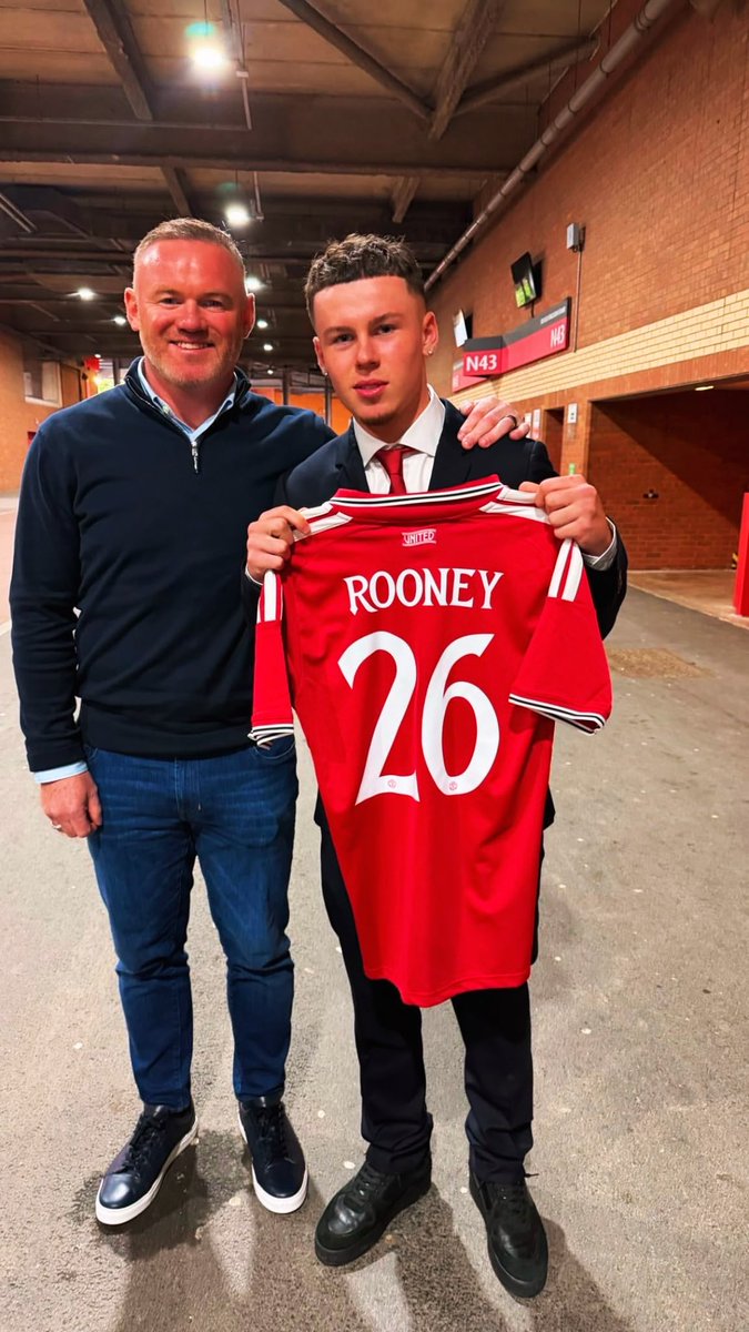 ManUnitedZone's tweet photo. Kai Rooney with his dad, Wayne Rooney, after signing his scholarship with Manchester United! 🔴 #MUFC https://t.co/VQm8o2EF6c