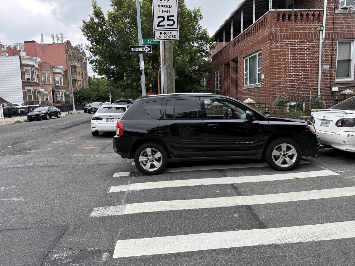 RiverSong33's tweet photo. @NYPD114Pct I guess this is Legal now to block the crosswalk and the handicap accessibility to cross the street. You send 311 a complaint nobody does the thing. https://t.co/W5IURvnN7Y