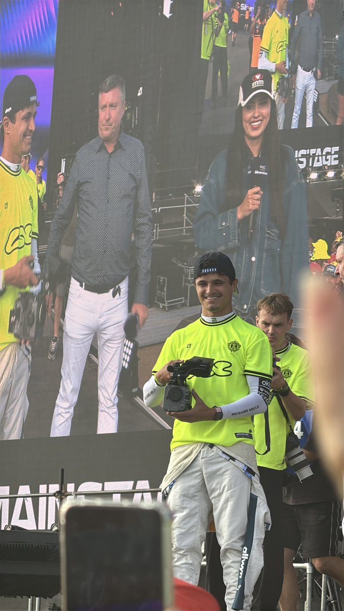 ln4norris's tweet photo. he went straight to the fanstage and still in his race suit 😭🤏🏻 https://t.co/bbYLoOAwBt