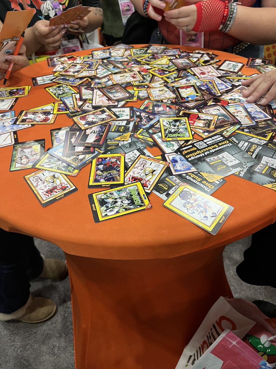 bryan_with_a__t's tweet photo. Big trading pile of manag cards at AX at emaqi booth #emaqipremium https://t.co/7sgOP7BlX2