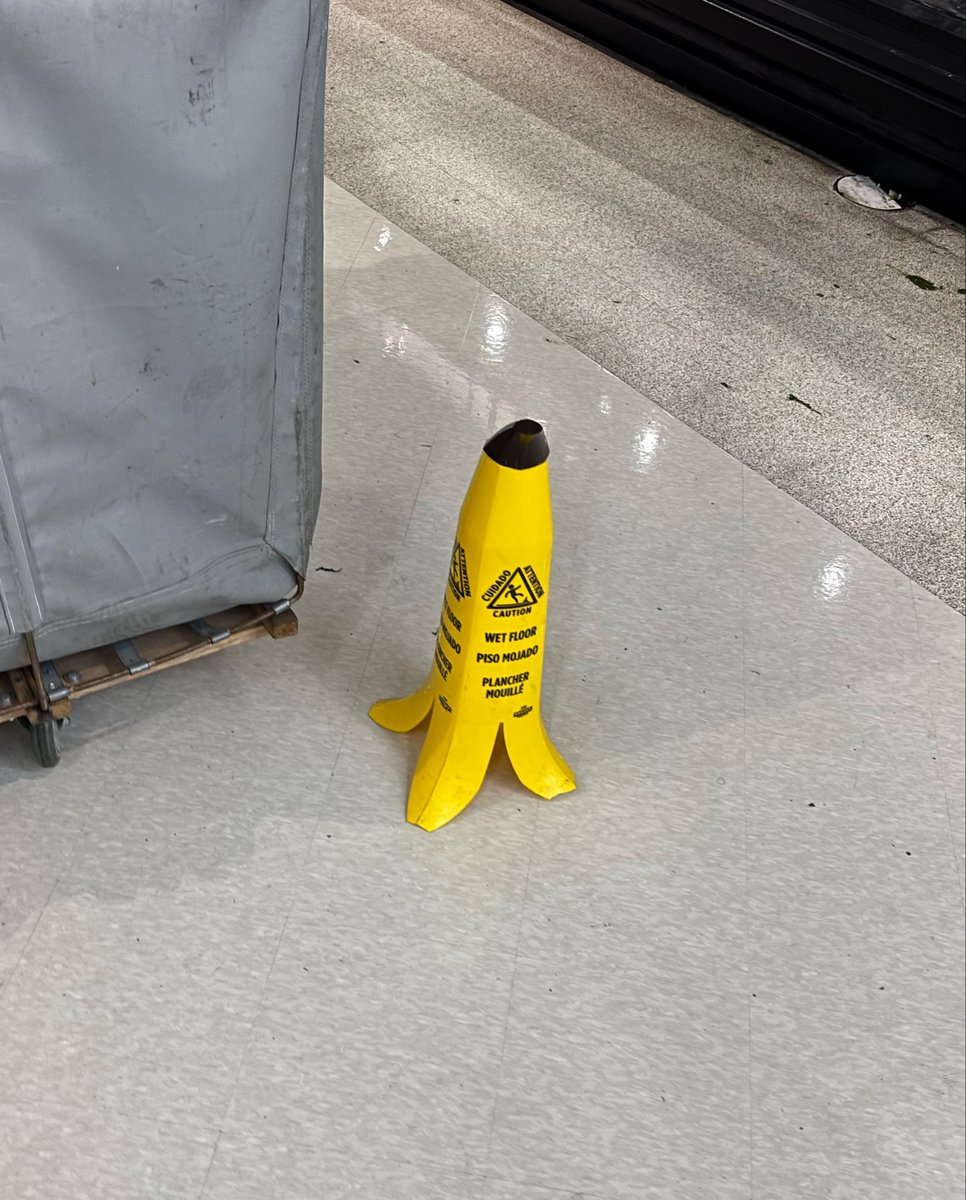 happynormalboy's tweet photo. wet floor sign in the shape of a banana peel is what i’m fucking talking about!!! https://t.co/Kzx5lsLoT8
