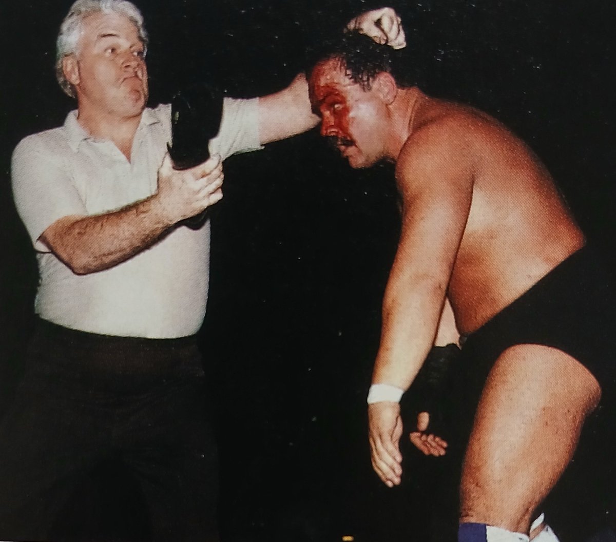 WrestlingIsKing's tweet photo. JJ Dillon uses his shoe to dole out some extra punishment to his former charge,an already-bloodied "Cowboy" Ron Bass back in 1985 https://t.co/5aw3aKzZ3Z