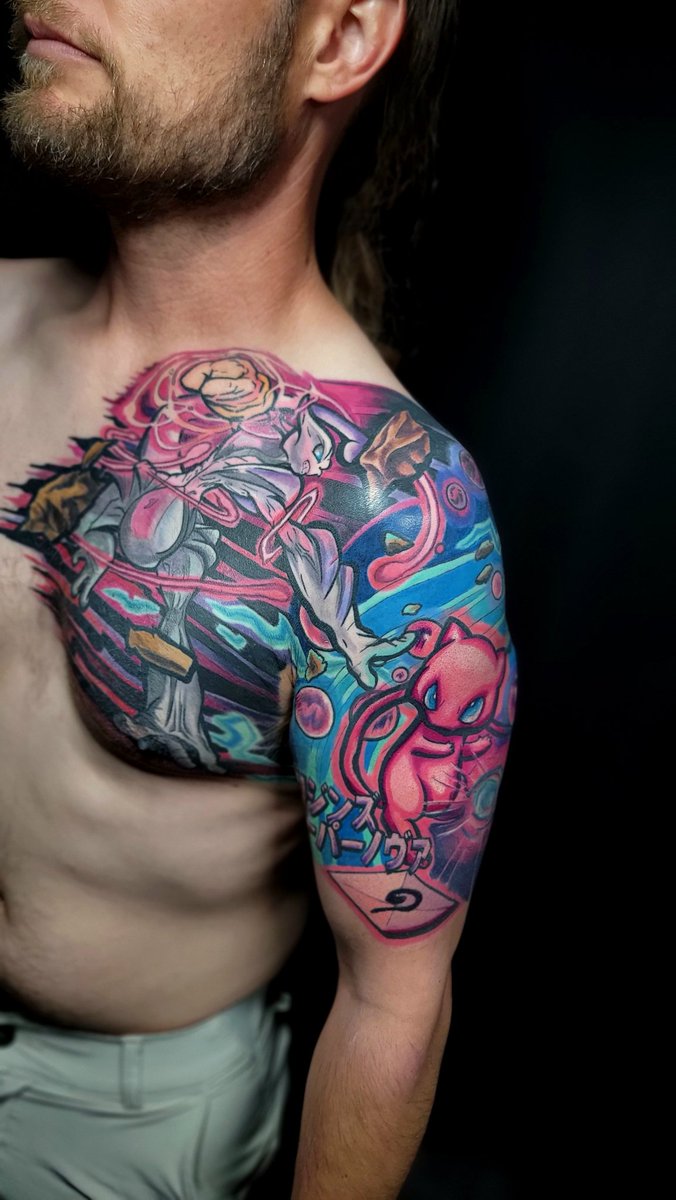 Konigkid's tweet photo. Finally finished my #Pokemonart My tattoo is Mew's Genesis Supernova vs Mega Mewtwo X #pokemon #tattoo https://t.co/MoKrPPp3Kq