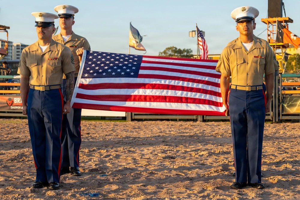 MRFDarwin's tweet photo. Not our first rodeo🇺🇸🇦🇺🐂

U.S. Marines with VMM 268, MRF-D 26, presented the colors and sang the national anthem at the Top End Bull Spectacular 2026 in Darwin, Australia, July 4, 2026.

📸Lance Cpl. Andrew Whistler

#USMC #America250 #TopEndRodeo #MRFD #Marines #Darwin https://t.co/sDGFbGjciy