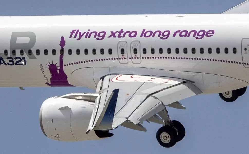 Fahadnaimb's tweet photo. Easy way to tell a regular A321neo from the XLR on the tarmac: that noticeably longer belly fairing under the rear fuselage protects the Rear Center Tank and adds strength for safety. Also, the inner flaps are single-slotted now instead of the double-slotted ones on standard neos. The XLR marking on the tail makes it obvious too.