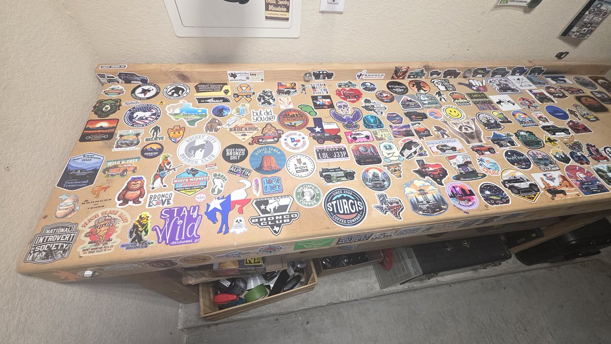 williebones1965's tweet photo. Got bored and didn't have anyone to do stuff with and decided to decorate my workbench and get plexiglass to put over them. They are stickers from Bronco clubs, adventures, trips, and from people I met. https://t.co/TrNwNVfjXU