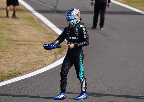 kimi didn't take off his helmet after the race, even after he got