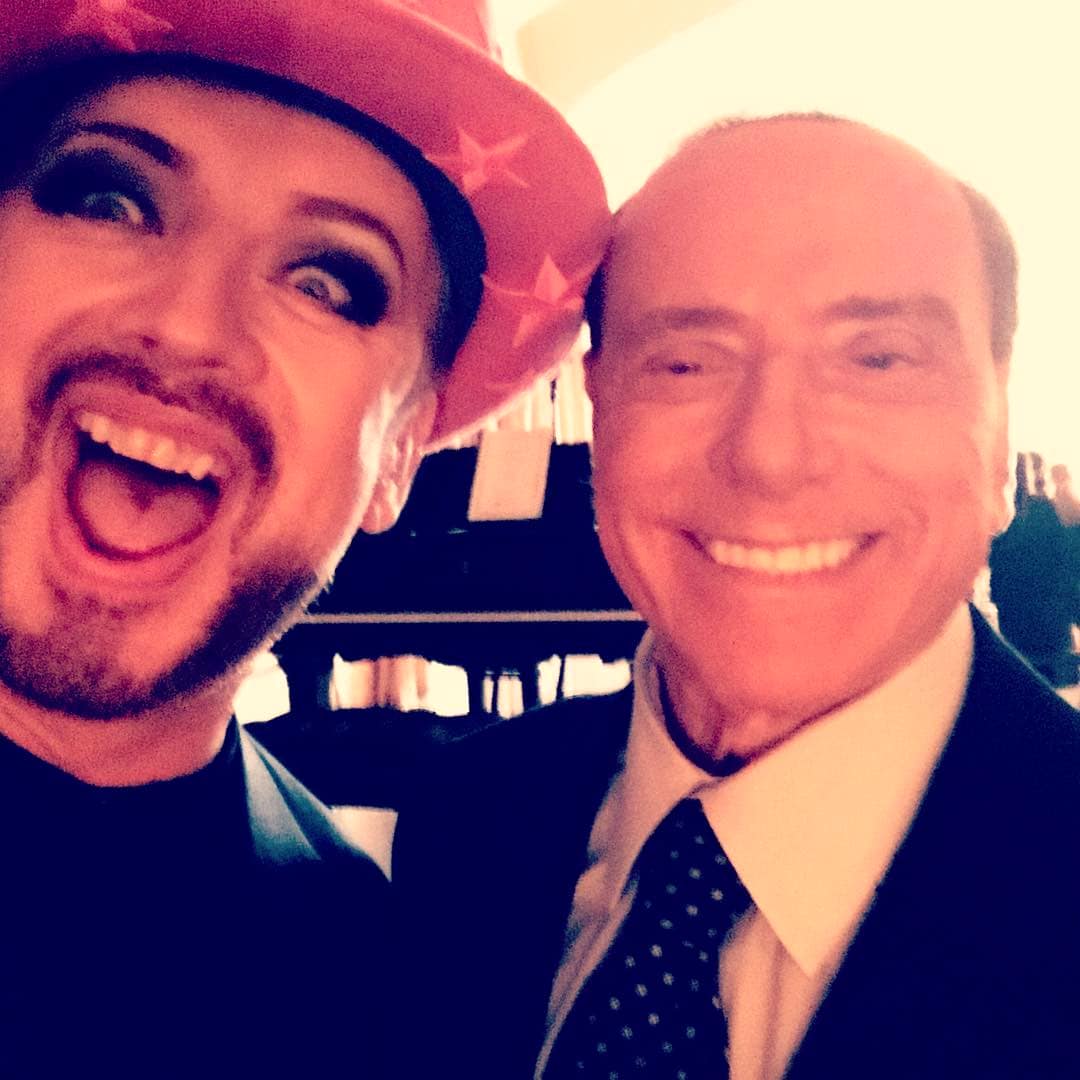 BoyGeorge's tweet photo. The idea, that as a gay man, I should join the noise and slag of political leaders is just a laughable cliche. When anyone asks me about 'President Donald Trump' I tell them we share a birthday. It shuts them up instantly and stops me having to have another boring, predictable, ethereal, conceptual conversation about someone I have never met. I would happily take a photo with the president to add to my collection. PS. I love America.