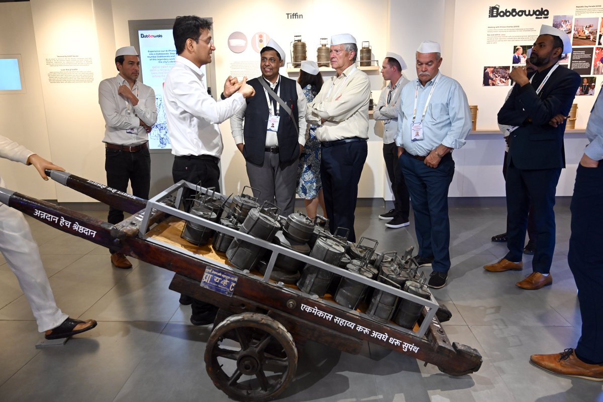 nlcbharat's tweet photo. The visiting NCSL @NCSLorg  delegation of U.S. as part of the NLC Bharat–NCSL USA LEAP Programme engaged with Mumbai's Dabbawalas @mumbaidabbawale , whose century-old distribution network stands as a global case study in discipline and organisational excellence. https://t.co/wcaCxDCxsv