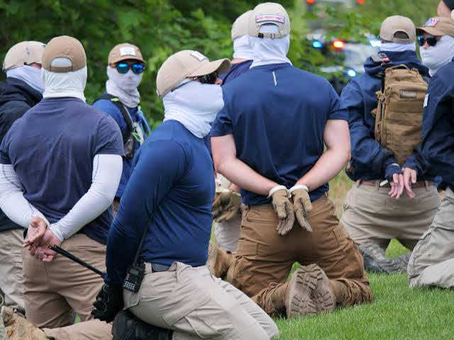 LostInQSpace's tweet photo. @MaximusChud @Landeur Zip-tied. MSM present for photos. Masks still on. https://t.co/RS0EyTxqEQ