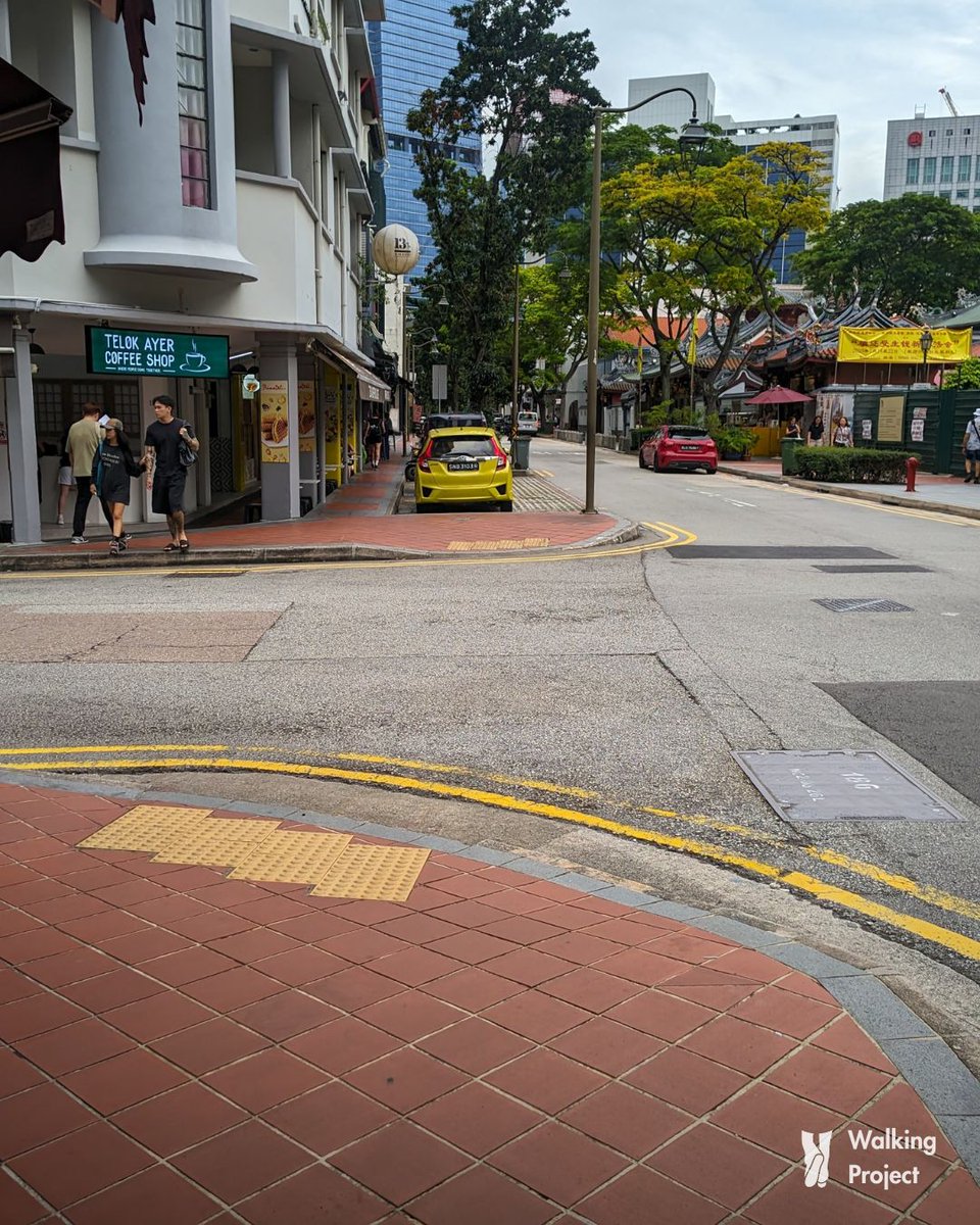 walkingproject's tweet photo. Last month, I had the privilege of visiting Singapore, where I spent a week experiencing its urban environment.

Over the next few days, I'll be sharing some observations on what made it feel exceptionally walkable to me, through photos I clicked during my visit.

Observation 1: 99.9% of the footpaths had sloped kerbs with tactile warning surfaces for visually impaired people. Walking on and off the footpath was so effortless that I rarely experienced the kind of knee pain I usually feel in Mumbai after a day of rigorous walking, even though I walked far more in Singapore than I do on an average day in Mumbai.

#SingaporeDiaries #WalkingProject

1/3
