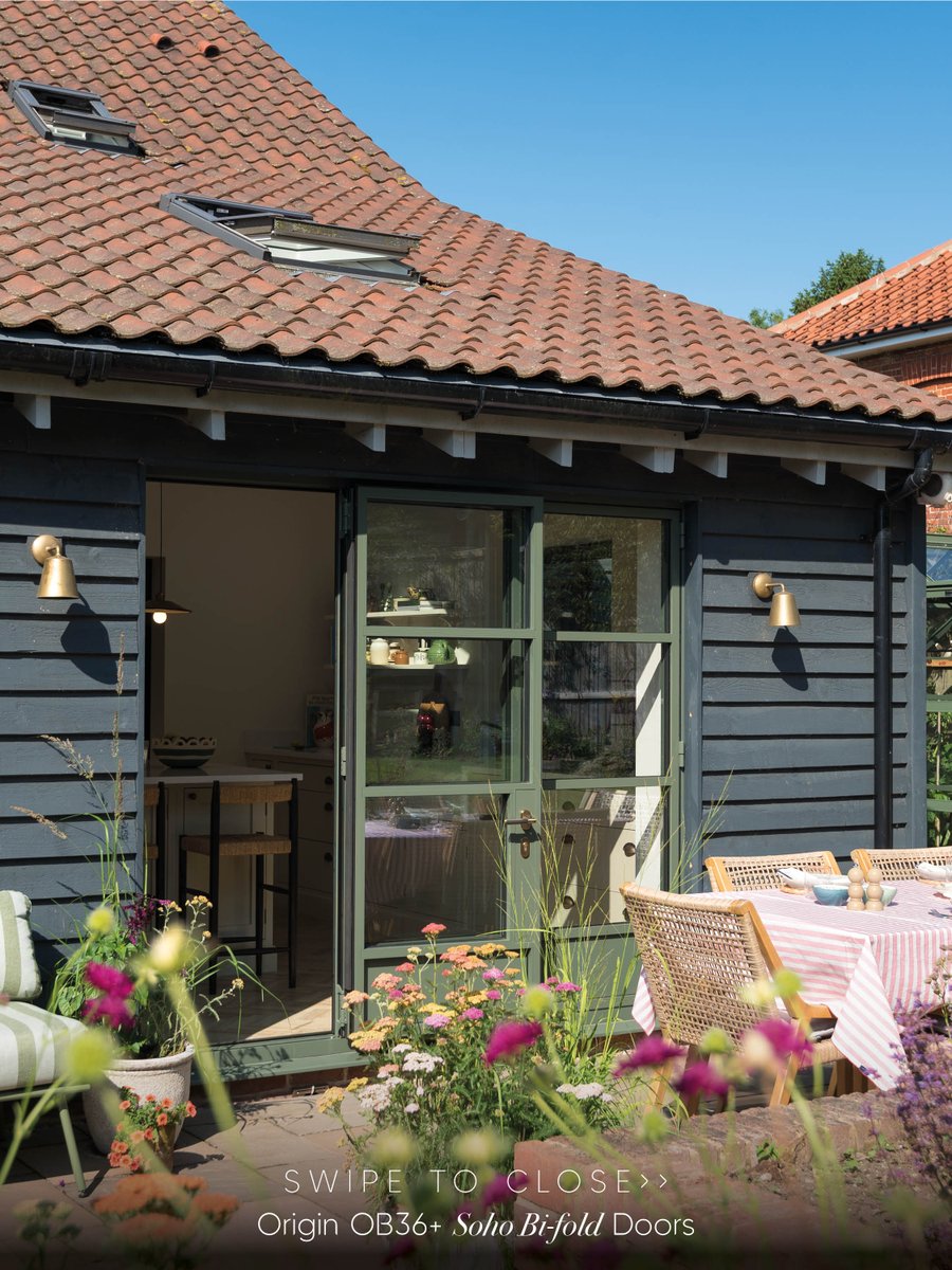 Originbifolds's tweet photo. Some homes simply belong in the countryside. 🌿

Designed by @bramleyandbear, this beautiful Norfolk home is full of thoughtful details. Finished in RAL 7009M Green Grey, these OB36+ Soho bifold doors feel bold enough to stand out, yet soft enough to sit effortlessly within the landscape.

The soho bars and solid lower panels frame the garden like a series of photographs, while our Signature knurled antique brass handles complete the look beautifully.

Swipe to watch the doors close so you see them in all their beauty... but let us know. Would you choose Green Grey for your own home?💚🩶

#OriginGlobal #BifoldDoors #LuxuryHomes #CountryHome #HomeInspiration
