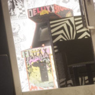 GTAWikiOfficial's tweet photo. A "Deluxe Fluxx" arcade machine can be seen in a GTA 6 screenshot inside the new Electric Fang Tattoo parlor's interior.

The Deluxe Fluxx Arcade was a real-life pop-up arcade in Miami Beach in 2013, designed by FAILE, the collective behind the Electric Fang Tattoo shop. https://t.co/tGPExxjgFJ