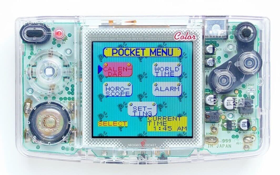 american80s's tweet photo. "Well, basically, I just copied the Neo Geo Pocket we have now. Then, I added a colour screen. And this translucent casing here I feel is pretty sharp." 

#NeoGeo #SNK #NeoGeoPocket #Y2K #IndustrialDesign #RetroGaming ☀️🌴 https://t.co/bo3uNdiGp9