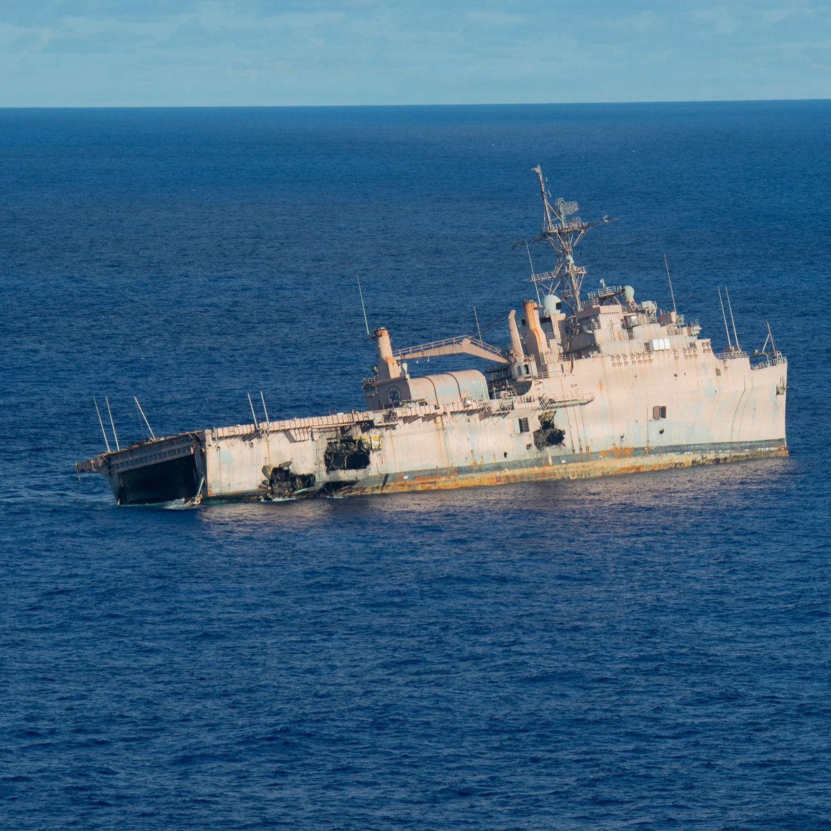 Boneyardsafari's tweet photo. USS Juneau LPD-10 sure took a beating during Valiant Shield 2026 in the Philippine Sea, June 27, 2026. Two AGM-84D Harpoons hit her, along with a LRASM from a B-2, and finally she was torpedoed by a Japanese submarine. #ussjuneau #lpd10 #sinkex #valiantshield #boneyardsafari https://t.co/y8qRikrRa4