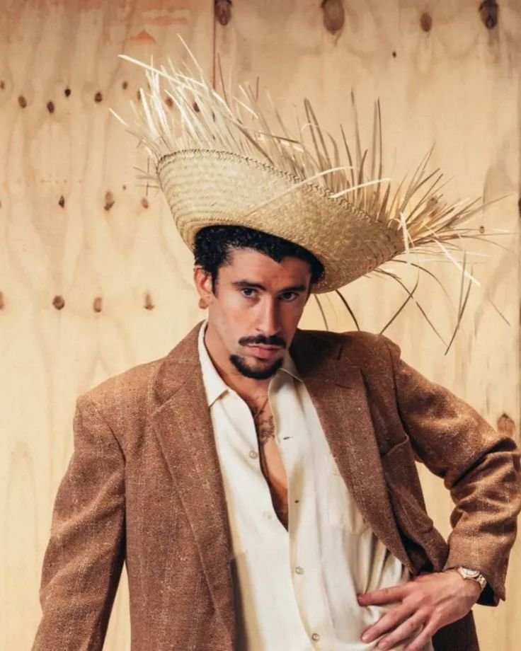 AccessBadBnbm's tweet photo. Surprise! 👀 Thought Benito was done breaking the internet this week? Redefining style by bringing traditional country roots into a high fashion space. He really keeps us guessing! 🌾blazer combo is unmatched. 🔥 #BadBunny #Fashion https://t.co/gA7A3Xy3xj
