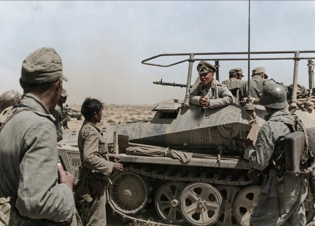 TheAxisCampaign's tweet photo. Field Marshal Erwin Rommel speaking with soldiers of the Afrika Korps from his Sd.Kfz. 250/3 half-track armored vehicle.

Tobruk Barca Libya North Africa 1941. https://t.co/Ha4wl3CQrZ