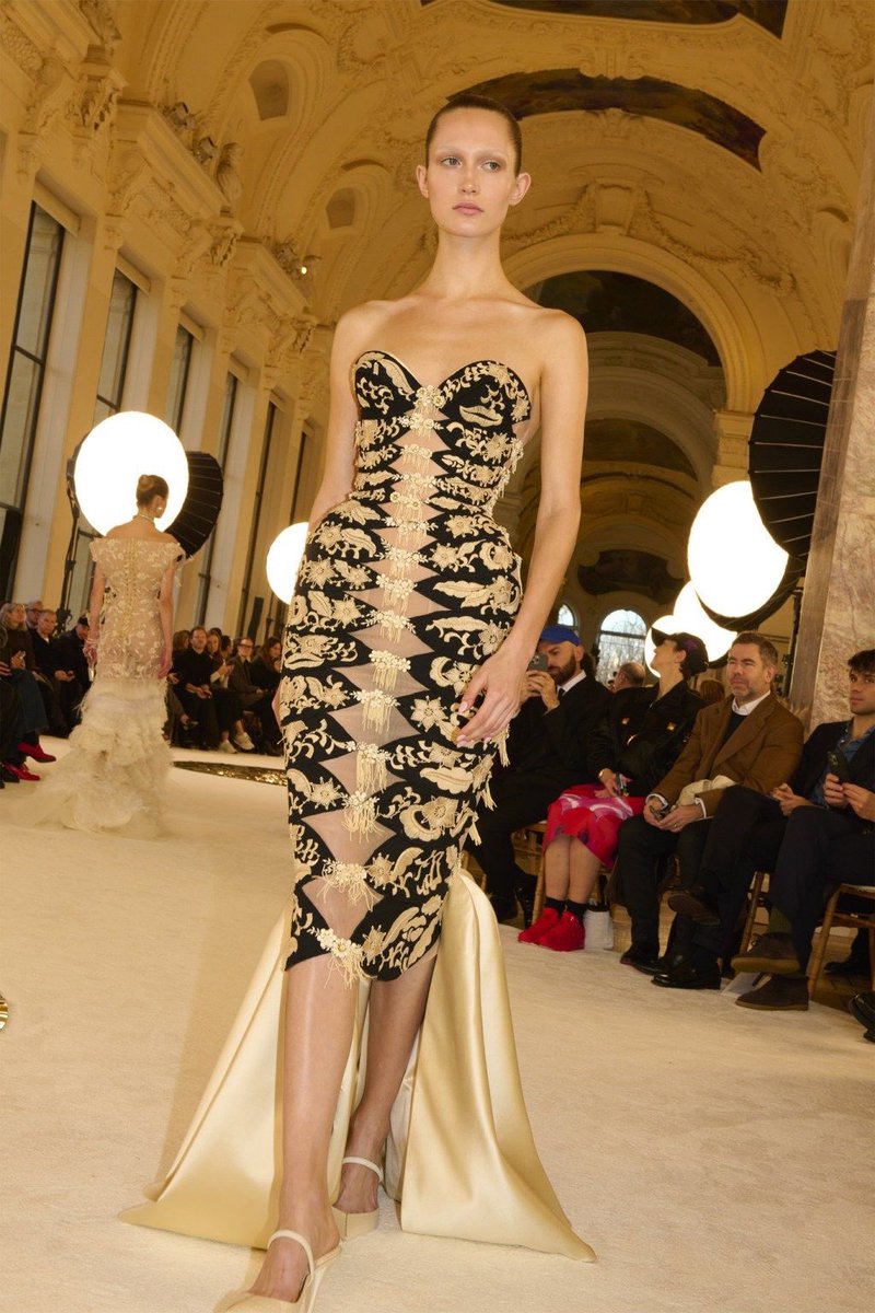 hannah_summers_'s tweet photo. gold embroidery on black fabric with a distinctive cutout design https://t.co/zQshZqbZ1r