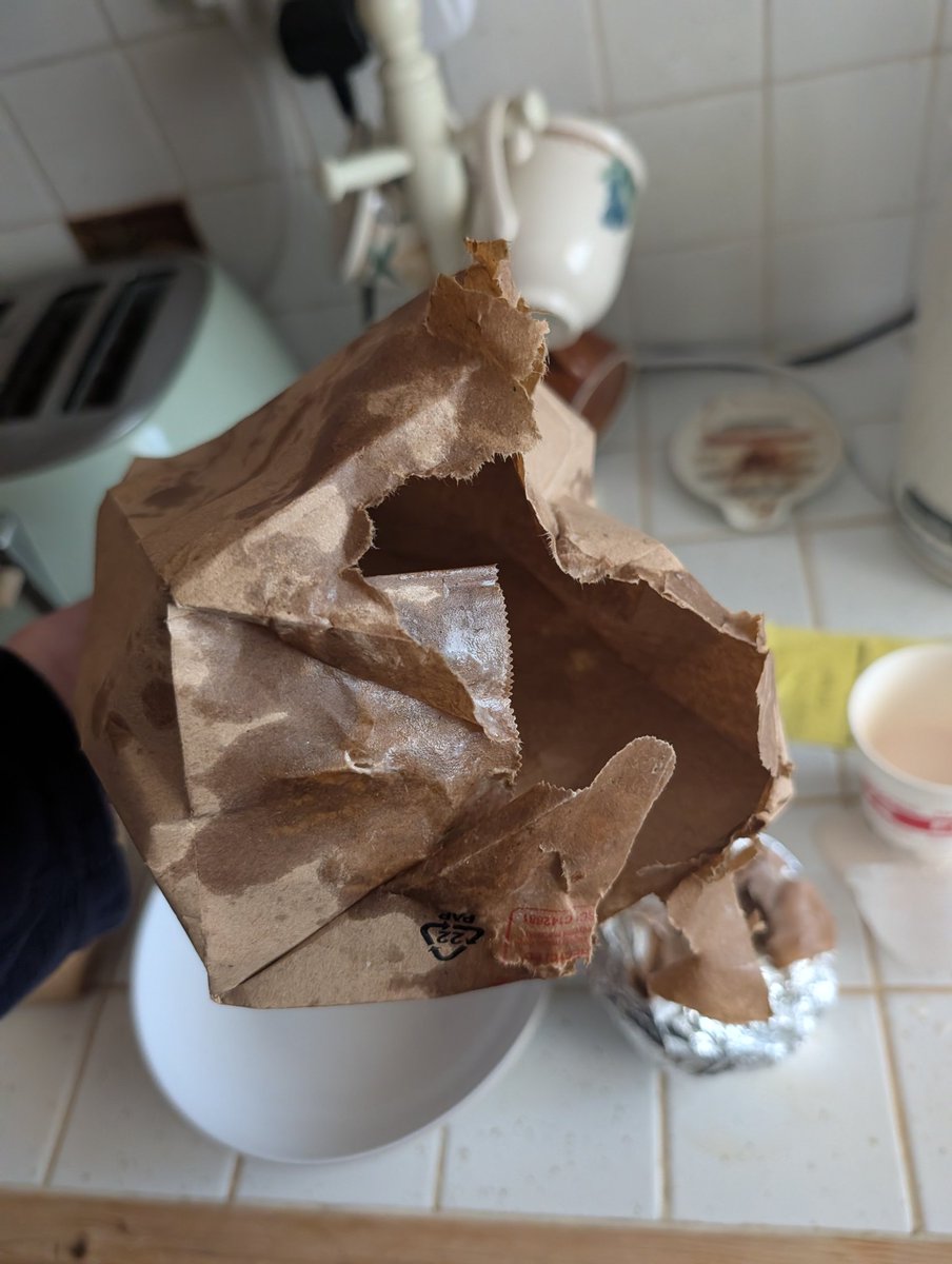 M_Willett's tweet photo. Ordered @FiveGuysUK from @JustEatUK to be delivered a soggy bag of chips and burger that the courier literally dropped on my hallway floor, apparently this isn't enough to get refunded https://t.co/dmRzU5kehb