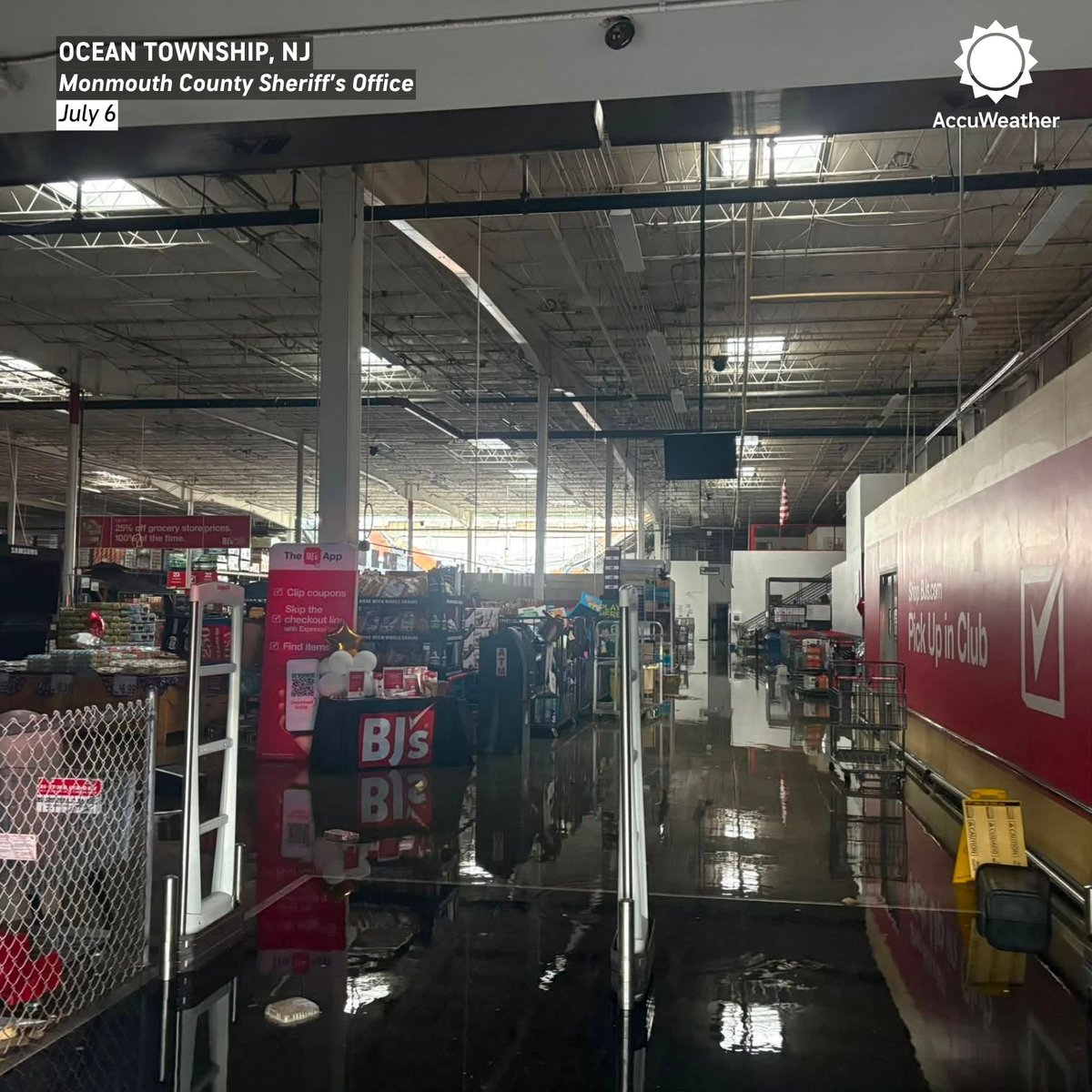 accuweather's tweet photo. The roof of a BJ’s Wholesale Club in Ocean Township, New Jersey, collapsed Monday under the weight of rainwater. The sheriff's office said 27 people were inside at the time and that no one was injured. https://t.co/0xeDXqAi06