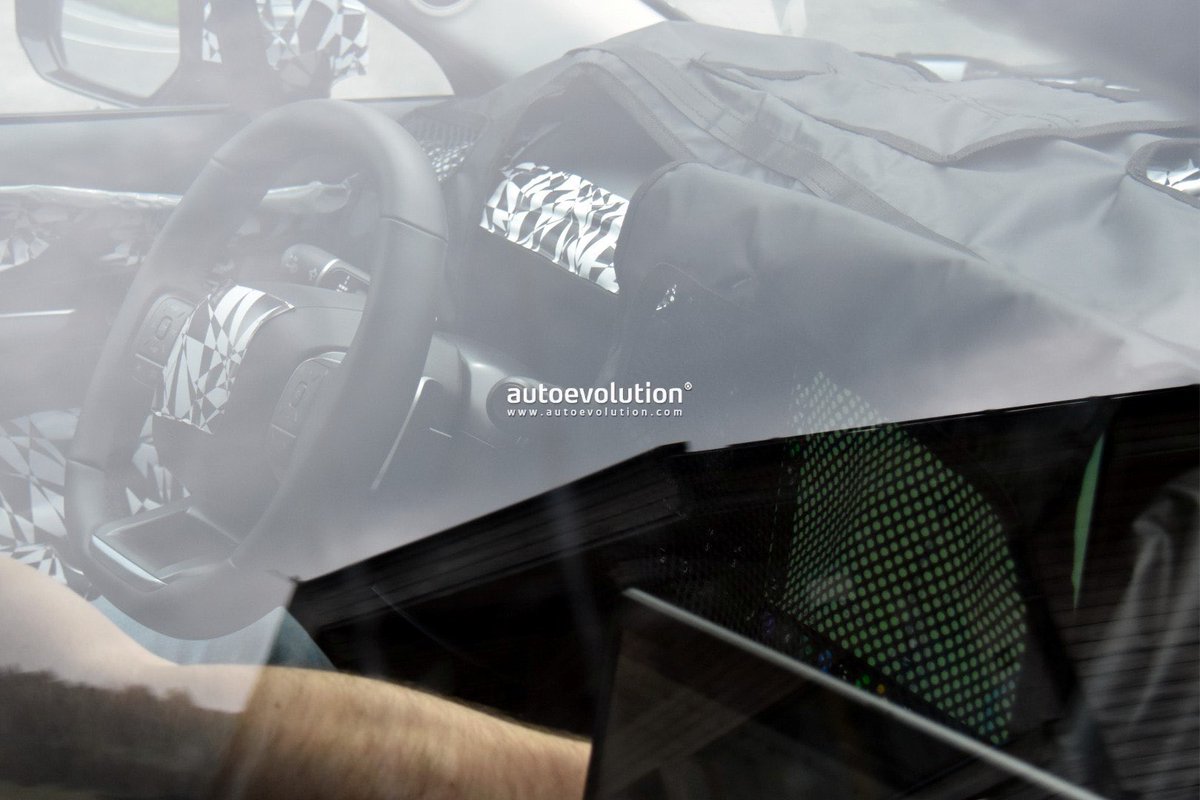 cole_marzen's tweet photo. The ‘27 Hyundai Tucson reveals its completely redesigned cabin in our latest batch of spy photos. From what we can see, the CUV will feature a 9.9-in. digital instrument cluster, a large 17.0-in. center touchscreen display with Pleos OS and Gleo AI, and a chunkier steering wheel. https://t.co/Acq2CA95ih
