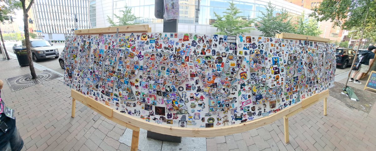 OkayDonuts's tweet photo. Idk if this site's compression is even gonna let this be readable, but here's the giant FURRYLAND sticker board that was outside #Anthrocon all weekend. Tag yourself/your friends! https://t.co/ELW0HXdGoY