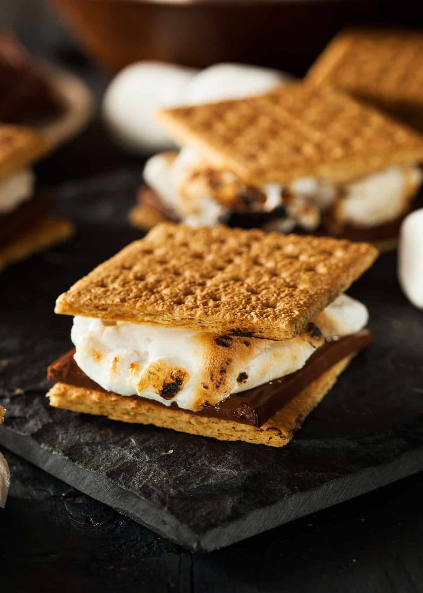 Valkobold's tweet photo. @LeopardFishWolf The campfire tradition of s'mores!

Marshmallows toasted over a fire and a piece of chocolate stuffed between two graham crackers. He would finish his own and then eagerly lick/bite the traces of marshmallow+chocolate from MC's fingers.

#BringBackValko #BringValkoBack https://t.co/BDnnrvRCPk