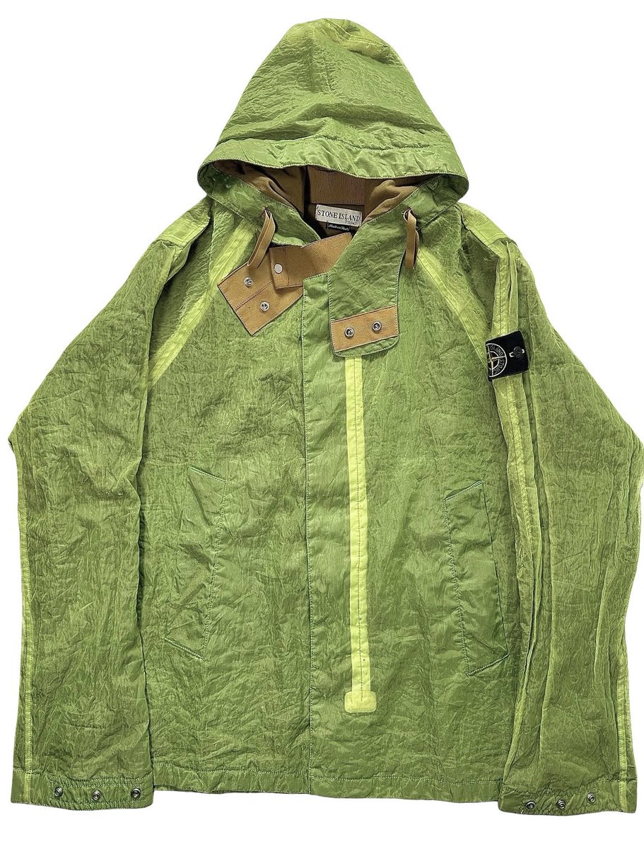 revesbleus's tweet photo. taehyung in a 2002 stone island monofilament archivio jacket. a 20+ year old archival piece from the iconic italian luxury outerwear brand… only he could make a translucent green jacket look this good https://t.co/i4UBknvsOc