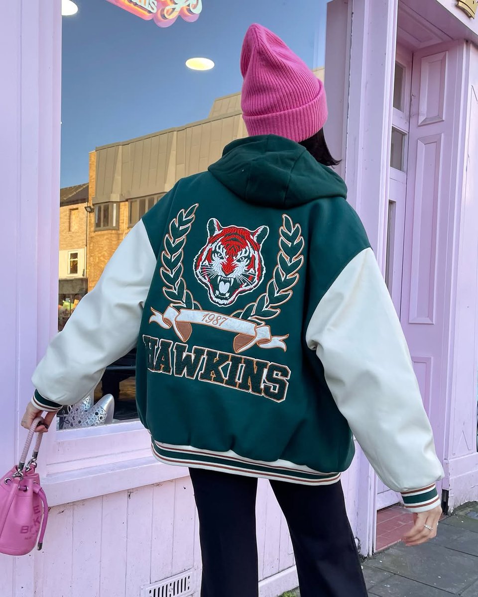 catlpatterson's tweet photo. Ad. How I'm wearing the  x Stranger Things collection. I'm an absolute sucker for a good graphic t-shirt and the oversized varsity jacket is an absolute classic don't you think?! Have you picked up anything from the collection? https://t.co/bAwHVJbhJM