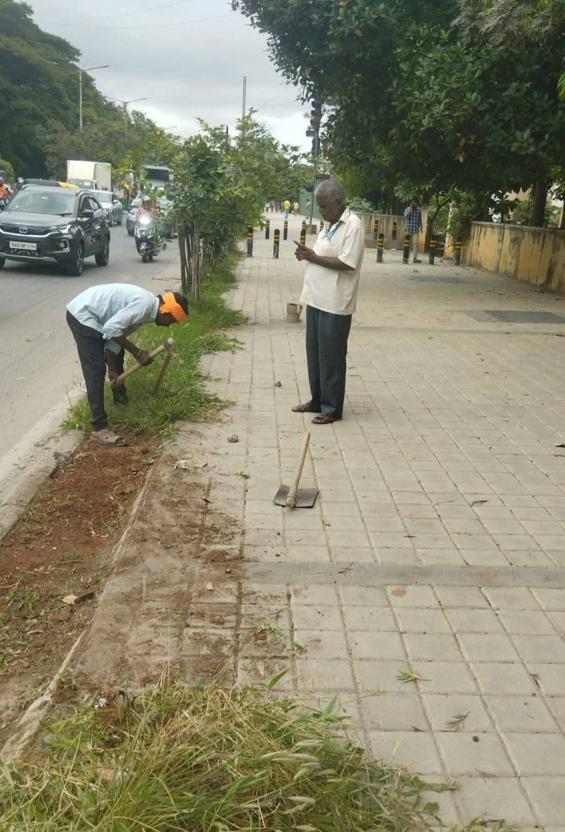 GBA_office's tweet photo. 🌿 Footpath Cleaning Drive

The Bengaluru Central City Corporation carried out a footpath cleaning drive near Gopalan Signature Mall on Old Madras Road, clearing overgrown weeds, grass, and unwanted vegetation along the sides of the footpath.

This initiative is being undertaken regularly to ensure safe and hassle-free movement for pedestrians while maintaining the city's cleanliness and enhancing its overall appearance.

Clean Footpaths – Safe Mobility – Beautiful Bengaluru. 🌿🚶‍♀️🚶

#DKShivakumar #Karnataka #Bengaluru #Footpath #pedestrians #GreaterBengaluruAuthority