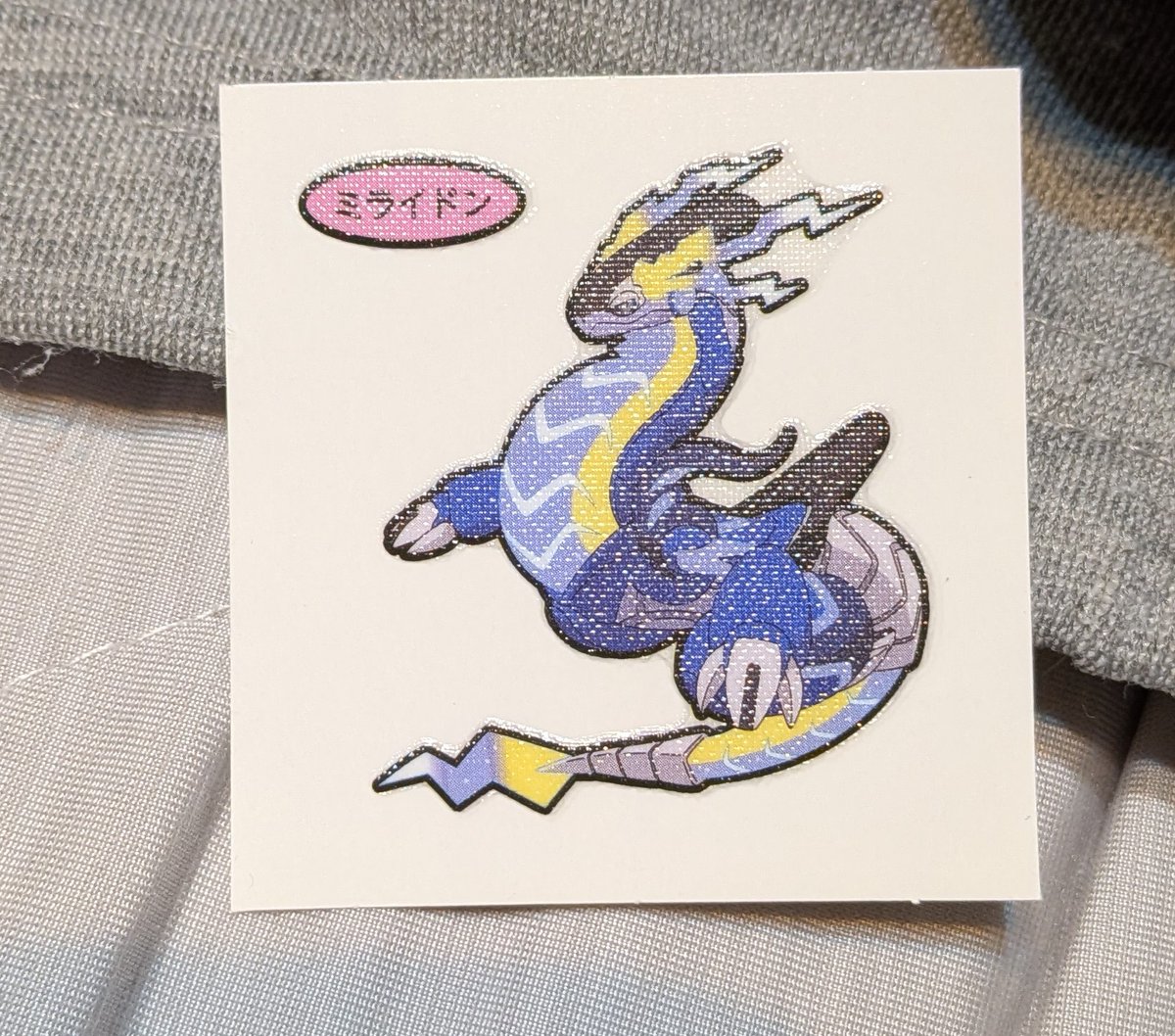 sol_62_11d's tweet photo. ポケモンパン　デコキャラシール

はい？ミライドンって？
まさか219弾？ https://t.co/ue9LWNZMlI