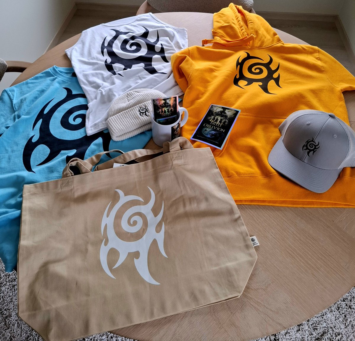 ta_toft's tweet photo. I'm thrilled to announce the official merch for The Corruption Saga series, available now on my website.

The arrangement of colors displayed here is only a selection of items. Browse the full store at: https://t.co/RT3wPlmWdo

P.S. The beanie is already a personal favorite. https://t.co/uU3pmnpKcP