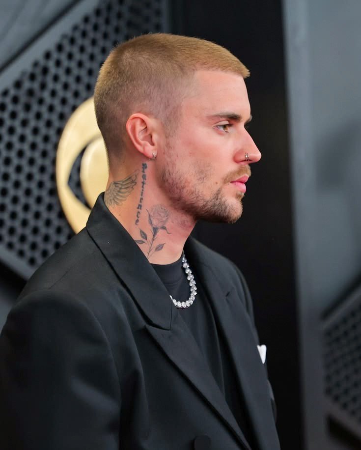 biebsdevotions's tweet photo. This shot of justin from the 2026 grammys omg the face, the fit, the nose ring, the chain, the tattoos, the facial hair, everything about him is gorgeous and perfect ✨ https://t.co/1O7AUExdft