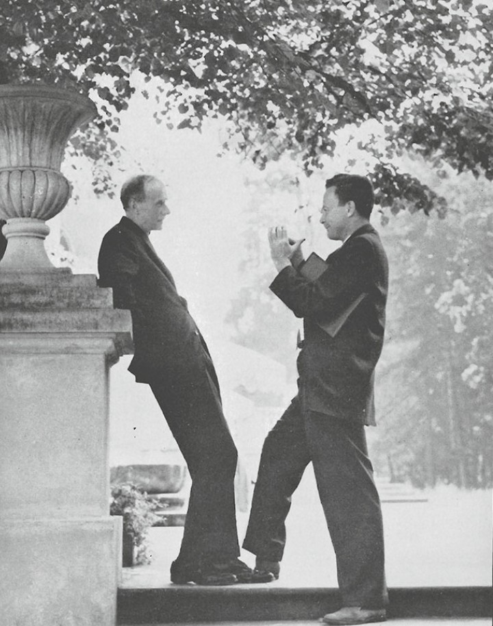 NobelPrize's tweet photo. Do you recognise the two Nobel Prize awarded physicists? 

These photos were taken when physicists Paul Dirac and Richard Feynman attended the international scientific conference on General Relativity and Gravitation in July 1962 in Poland. Here they are seen in deep conversation – presumably about quantum physics. It is said that Feynman idolised Dirac and saw him as one of his heroes. 

Dirac was awarded the physics prize in 1933 for formulating a fully relativistic quantum theory. The equation gave solutions that he interpreted as being caused by a particle equivalent to the electron, but with a positive charge. This particle, the positron, was later confirmed through experiments.

Fifteen years later (1948), in particular, Richard Feynman contributed to creating a new quantum electrodynamics by introducing Feynman diagrams: graphic representations of various interactions between different particles. These diagrams facilitate the calculation of interaction probabilities. Feynman received the physics prize in 1965. 

Photo credits: 
1) Caltech
2) Marek Holzman, CC BY 4.0 via Wikimedia Commons
