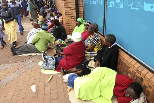 Manikipi's tweet photo. On the night when they heard their savings had been stolen by Malema, Floyd &amp; others, they went to VBS &amp; slept on the floor to get little that was left. 9yrs later still no justice for them. Instead, Malema runs a good EFF business which sends him to Gucci, LV, Durban July etc. https://t.co/Jmg49jm1mN