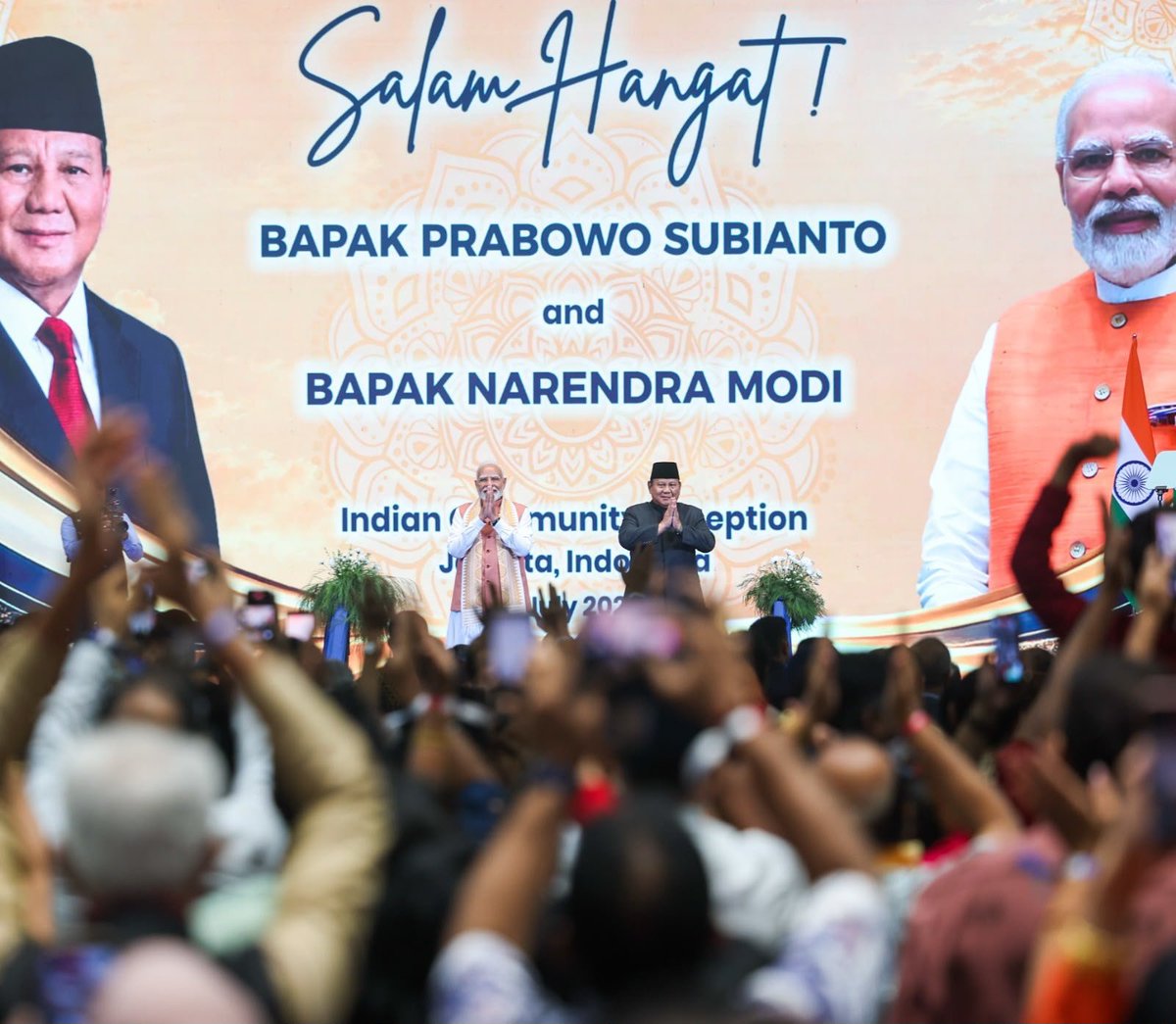 narendramodi's tweet photo. The atmosphere at the community programme in Jakarta was truly euphoric! Deeply touched by the warmth and affection of the Indian diaspora. https://t.co/CeKhUvUnv7