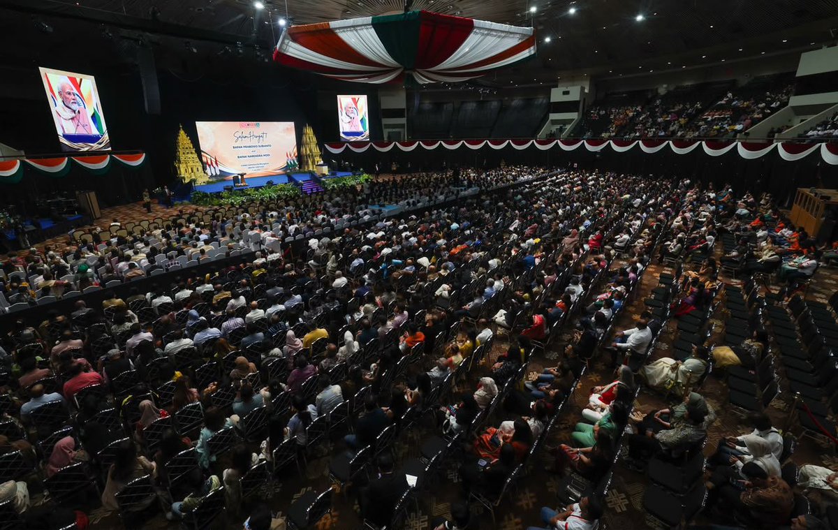 narendramodi's tweet photo. The atmosphere at the community programme in Jakarta was truly euphoric! Deeply touched by the warmth and affection of the Indian diaspora. https://t.co/CeKhUvUnv7