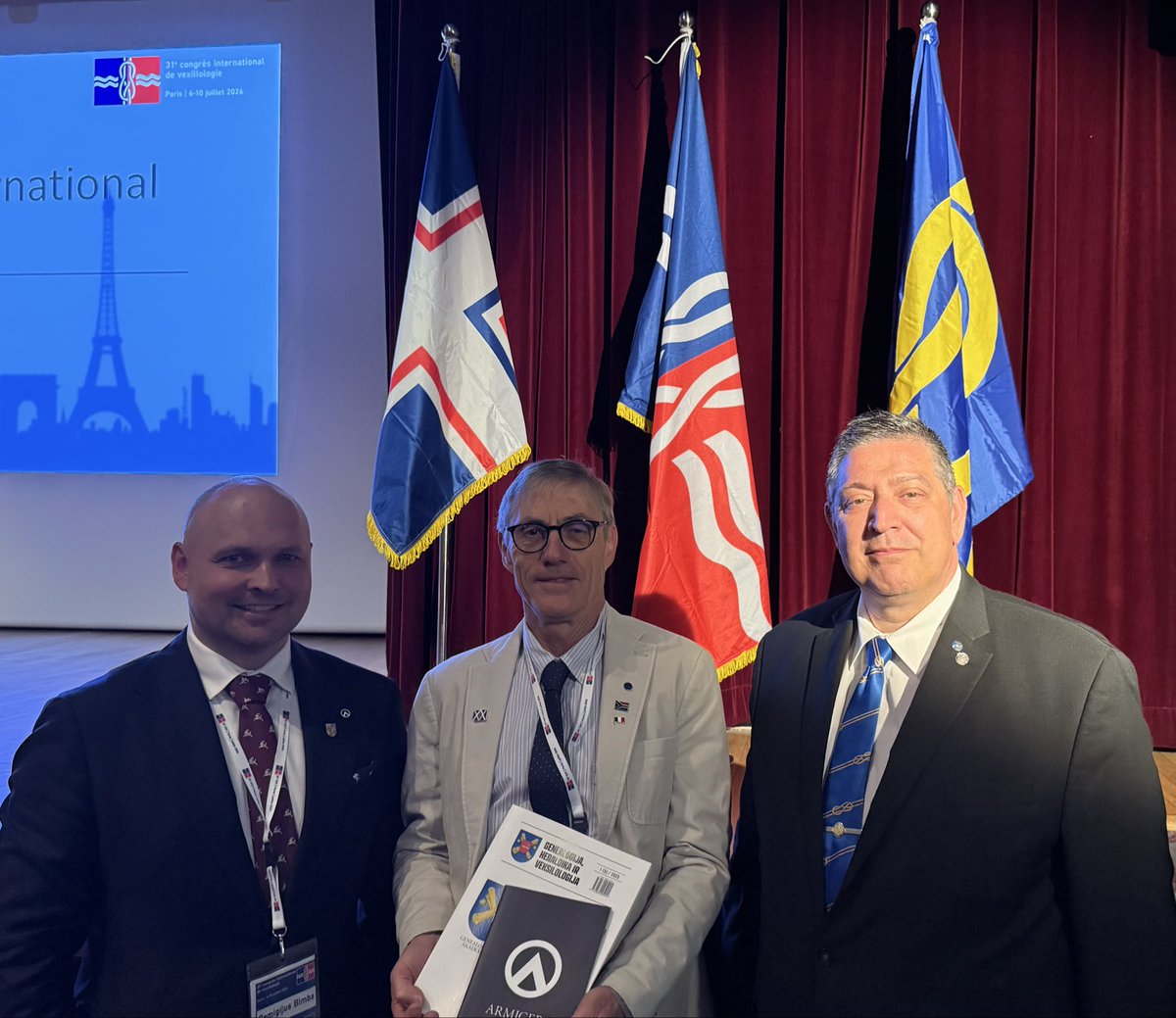 RemigijusBimba's tweet photo. Honoured to meet fellow members of the International Association of Armigers (IAA) during the 31st International Congress of Vexillology in Paris. I was pleased to present the latest GHVI publication and the IAA book to Dr Željko Heimer (Croatia) and Dr Bruce Berry (South Africa) https://t.co/160qnpruWu