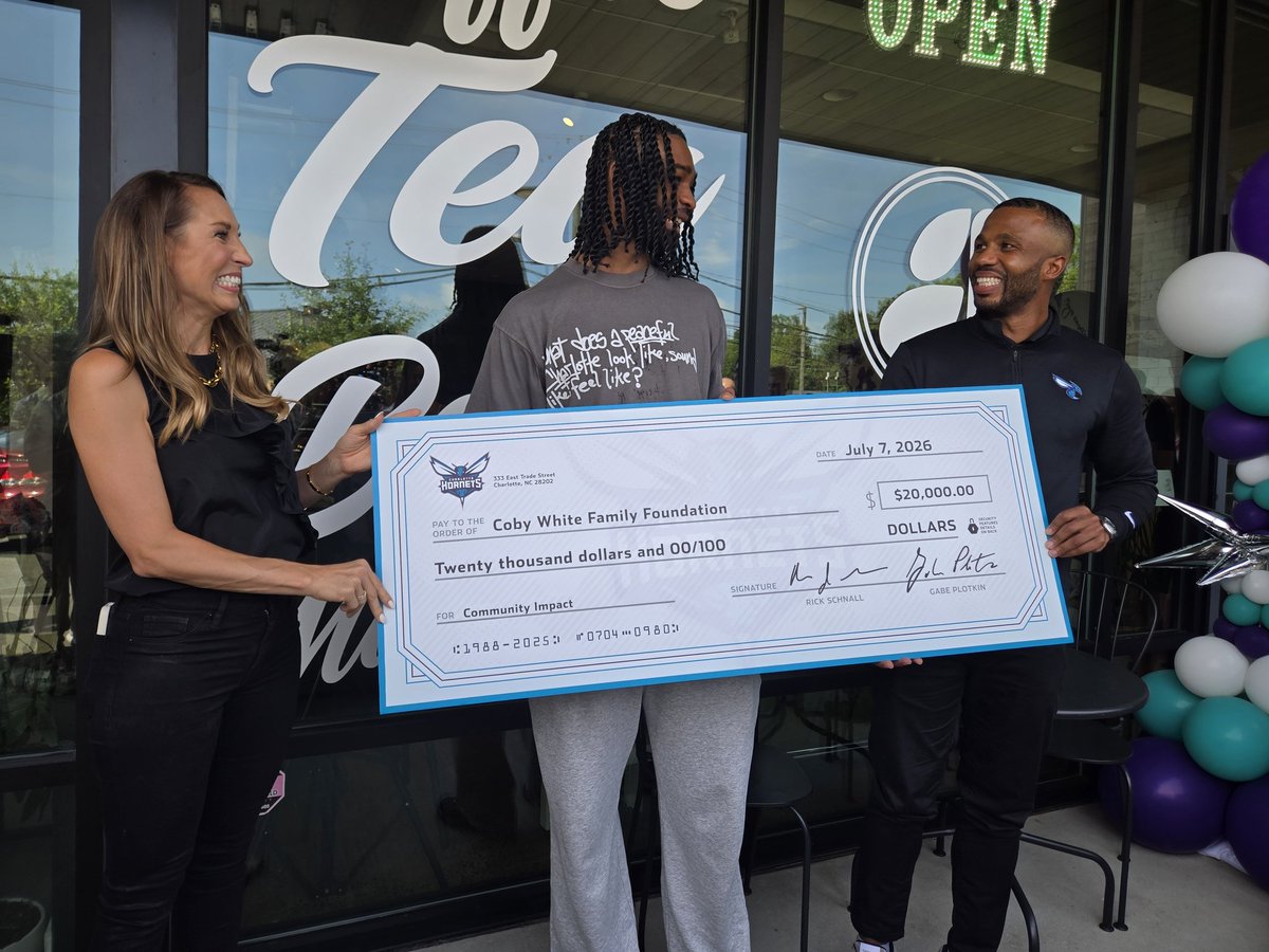rodboone's tweet photo. Funny/cool moment: Jeff Peterson and the #Hornets surprised Coby White with a check for $20,000 for his foundation.

Coby: "Oh shit!"

He said the moment caught him off guard and he started tearing up. https://t.co/BmmnN9rGxr