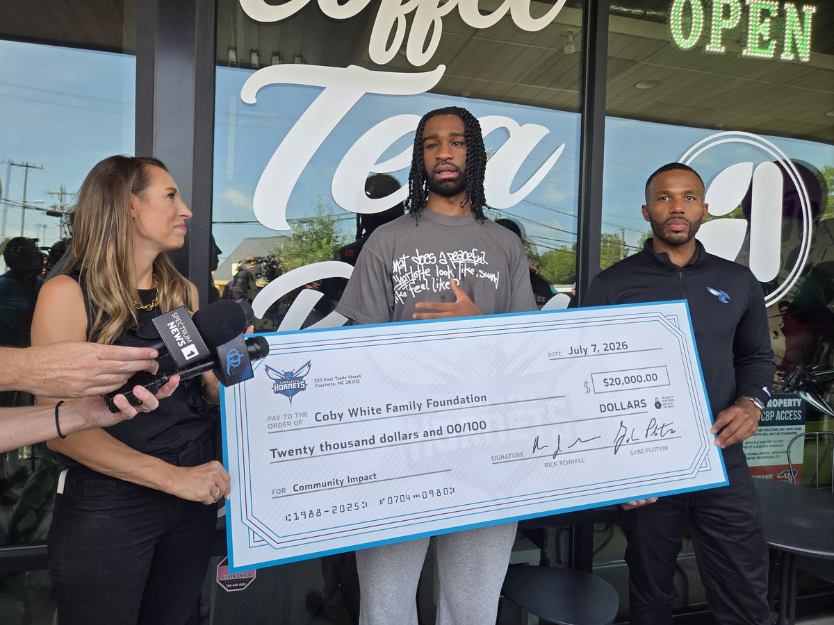 rodboone's tweet photo. Funny/cool moment: Jeff Peterson and the #Hornets surprised Coby White with a check for $20,000 for his foundation.

Coby: "Oh shit!"

He said the moment caught him off guard and he started tearing up. https://t.co/BmmnN9rGxr