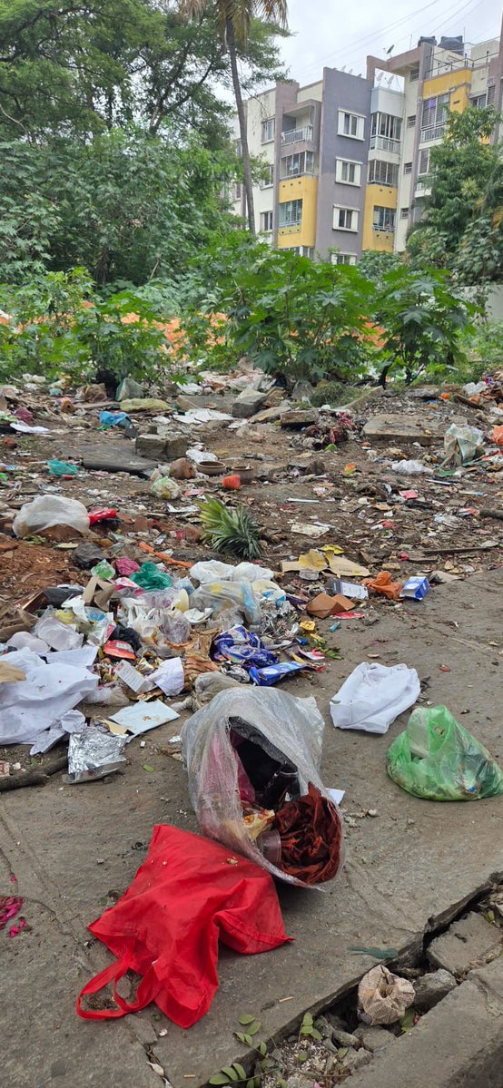 Praveen_Louis's tweet photo. Dear BBMP/GBA team, this vacant land beside our apartment has become a garbage dumping blackspot. It is causing severe hygiene risk, mosquito/rat menace, foul smell, and footpath obstruction. Requesting immediate action to clear this spot and take measures to keep this spot clean https://t.co/Va4waf6AXK