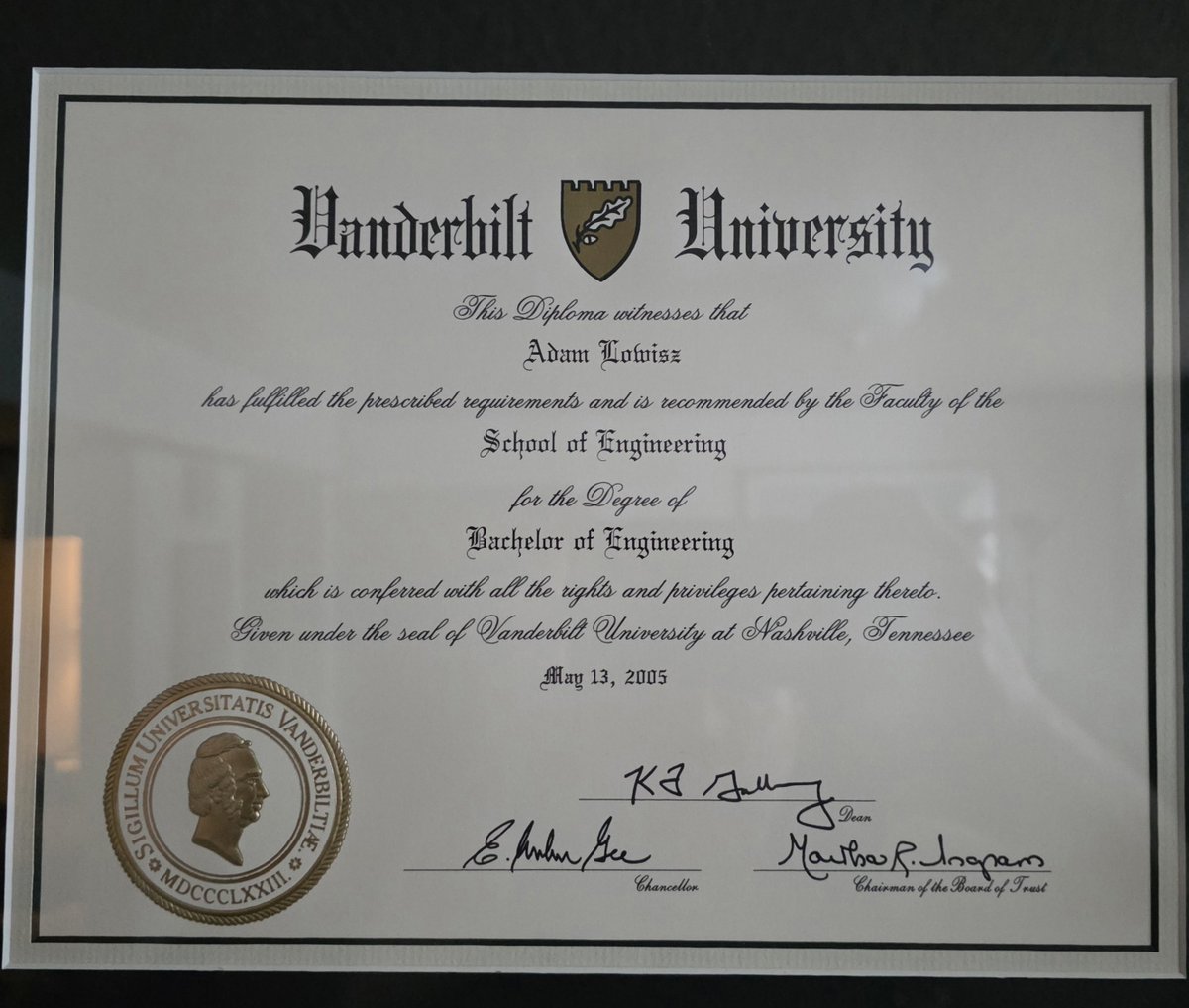 AdamLowisz's tweet photo. Elon and his friends follow me because I'm friends with them. That person who wrote nonsense about me (sonirw) blocked me so I can't reply to them so now I just blocked them back. She also claims I didn't go to Vanderbilt. Here's my diploma on display. There's lots of really mentally ill people on this platform and people who are not that bright that believe them.